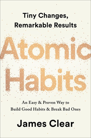 book cover for Atomic Habits -- eggshell color background with the title large and in shiny gold letters